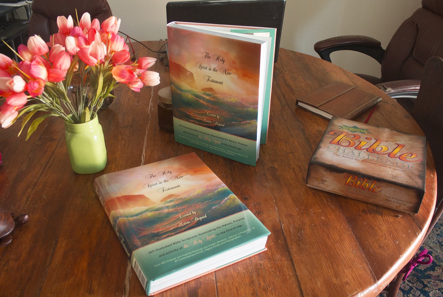 The Holy Spirit in the New Testament books displayed on a wooden table